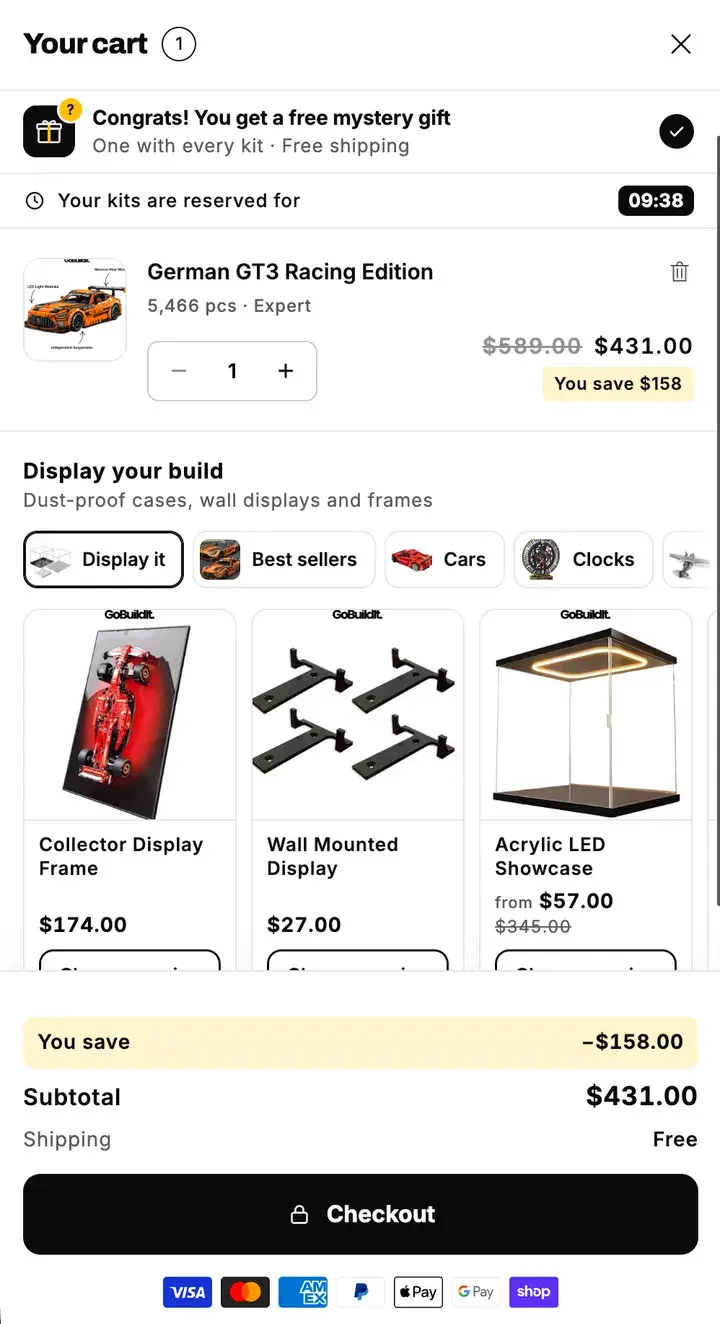 GoBuildIt's cart after: the gift on top, the saving in yellow, display cases for the kit and one Checkout button