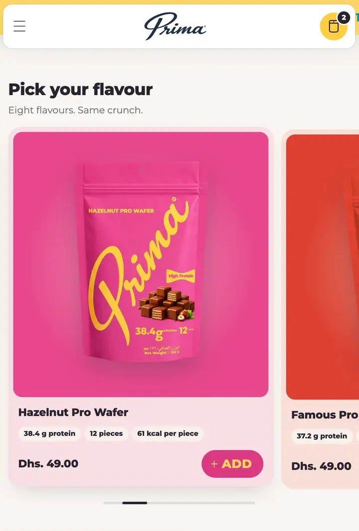 Prima's flavour slider on a phone: the Hazelnut card on its pink, with quick add